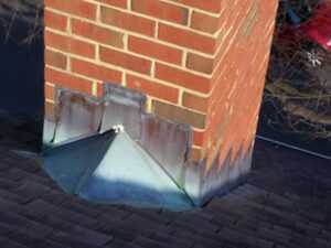 Flashing is designed to keep water from entering a building and causing leaks at key intersections, such as where a chimney penetrates the roof.