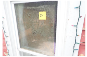 The policyholder was concerned the discoloration and mineral deposits resulted from a recent storm. The windows assessment determined it was age-related windowpane seal deterioration.