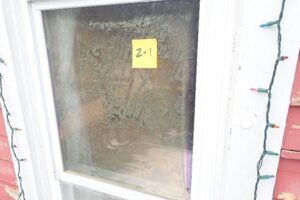 This window has sustained sealant failure caused by age-related deterioration, which has led to fogging and discoloration due to mineral deposits.