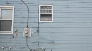 This distortion pattern is the result of reflected sunlight from a window on a neighboring house.