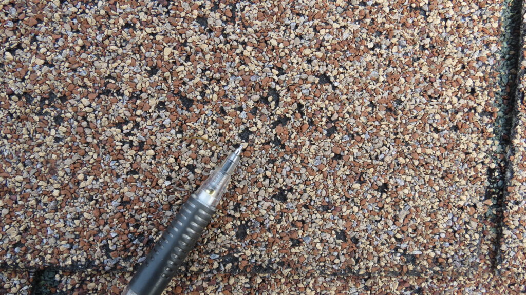 Weather reports indicated that hail had fallen near this property, but a Donan engineer determined that these blemishes were caused by heat blisters that developed over the life of the shingle.