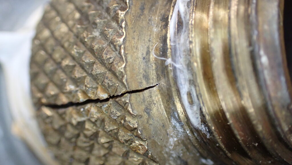 This brass coupling has become brittle due to corrosion or dezincification and has fractured under the stress. A CTL determined that the manufacturer did not meet the required standards for this component.