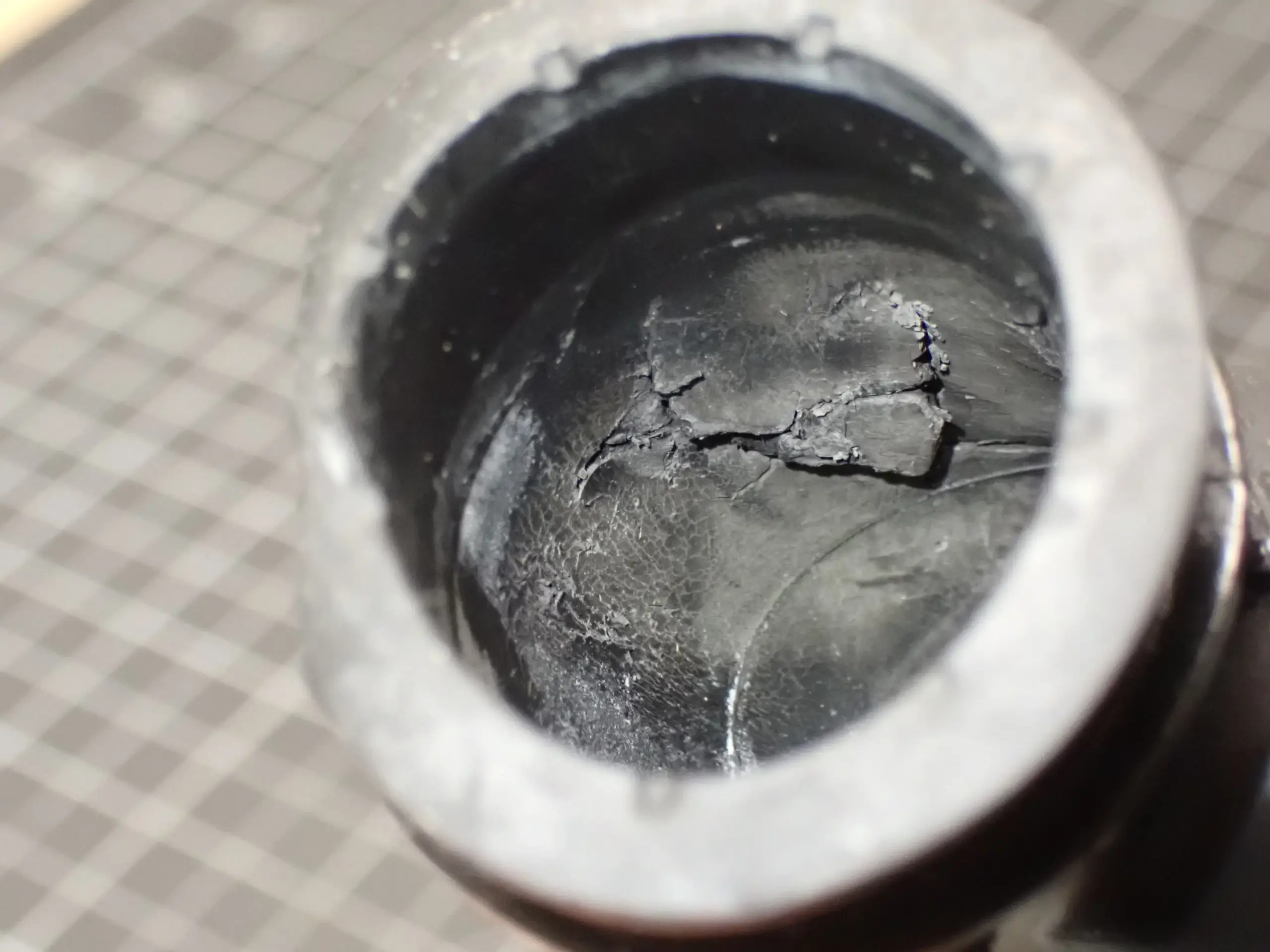 This TPE coupler is incompatible with chlorine found in dish detergent and has deteriorated as a result of repeated exposure.