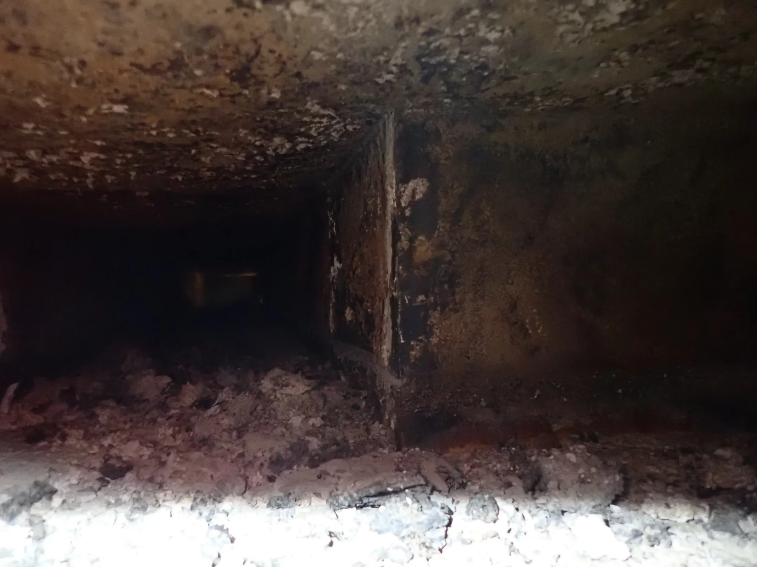 This horizontal run of exhaust duct for a wood-fired grill was identified as the probable area of origin in a restaurant kitchen fire.