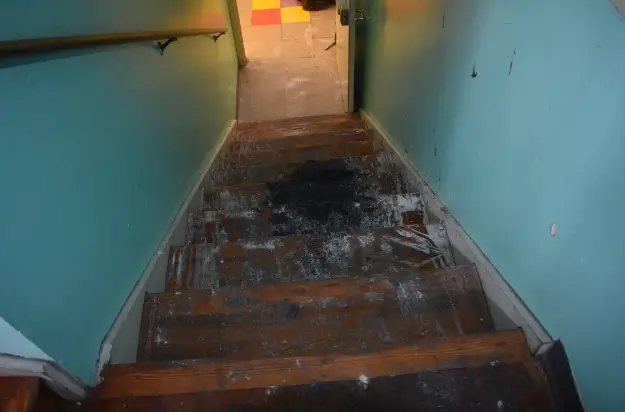 Investigators determined that the west staircase was the area of origin of this commercial fire.