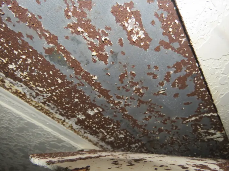 Inadequate drainage led to water intrusion and rust on this steel beam, which can reduce the lifespan of metal components and lead to full or partial collapse.