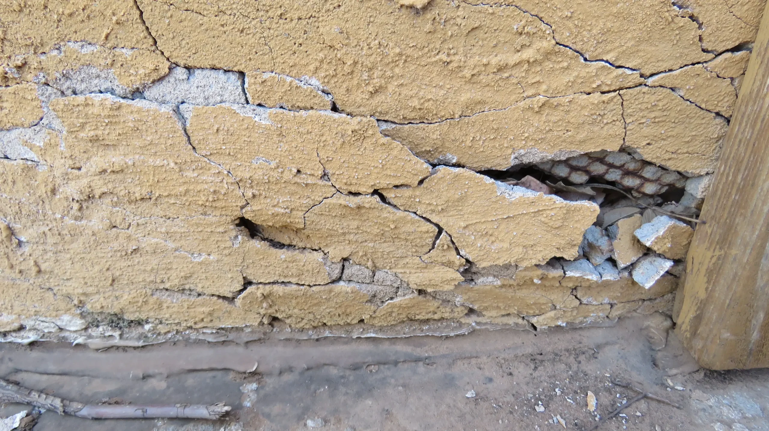 Improper construction and inadequate waterproofing may lead to cracking and water intrusion into the wall cavity, resulting in rusted lath and other structural damages.