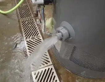 This image depicts a drain valve leak in a water heater, demonstrating that a failure has occurred.