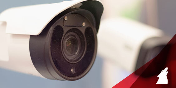 Close-up image featuring two security cameras, focusing on their structure and positioning for surveillance purposes.