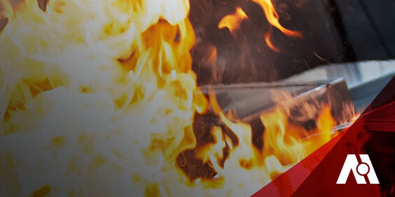 A kitchen fire burns brightly, with a prominent red and white logo visible.