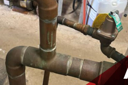 Close-up image of a pipe equipped with a valve, emphasizing the connection and functionality of the components.