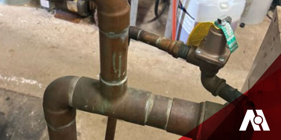 Close-up image of a pipe equipped with a valve, emphasizing the connection and functionality of the components.