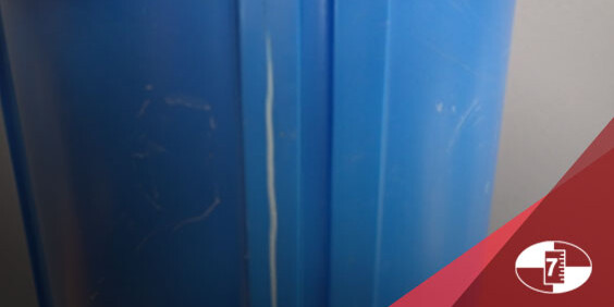 A blue plastic vase featuring a crack down the middle with Donan logo.