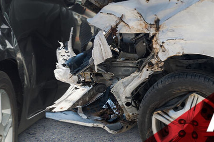 Damaged front ends of two cars after a collision