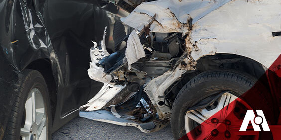 Damaged front ends of two cars after a collision