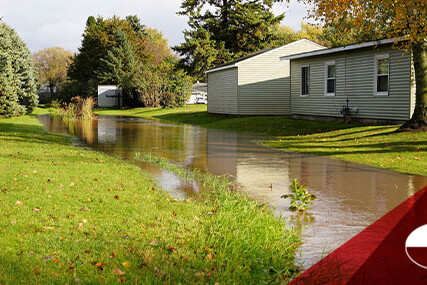 A residential street flooded with water