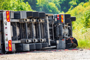 Large cargo truck turned over on road